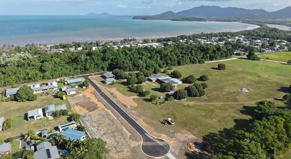 Aerial view of the Kurrimine Beach estate, coastal village and Coral Sea